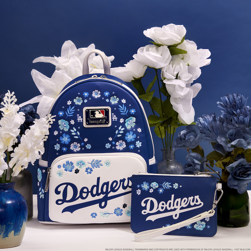 Blue and white floral Dodgers mini backpack and wristlet clutch against a blue background and surrounded by blue and white flowers
